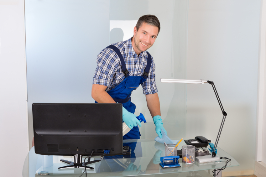 worker Cleaning Office desk Image
